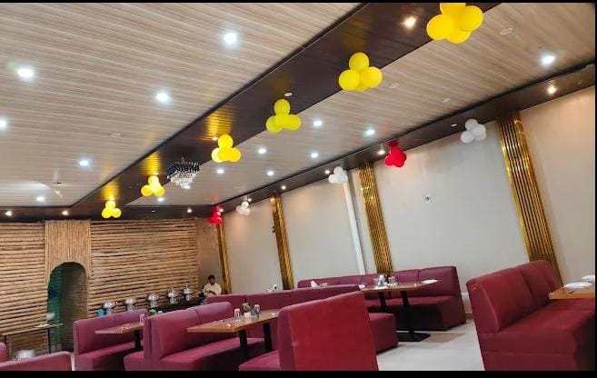 Tandoori platter, naan and curries served in a warm, softly lit Indian restaurant